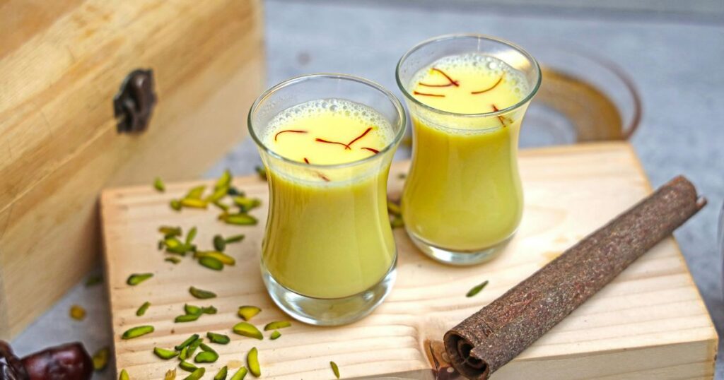 cup of warm milk topped with golden honey, perfect for relaxation and comfort.