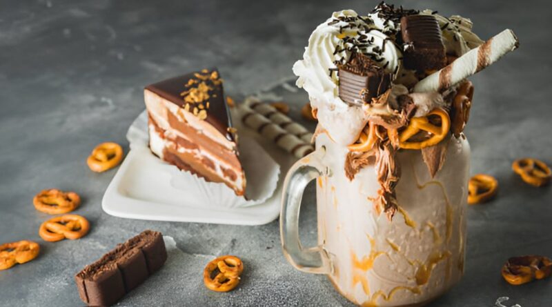 A rich chocolate milkshake adorned with pretzels and chocolate, named 'Death by Chocolate Shake.