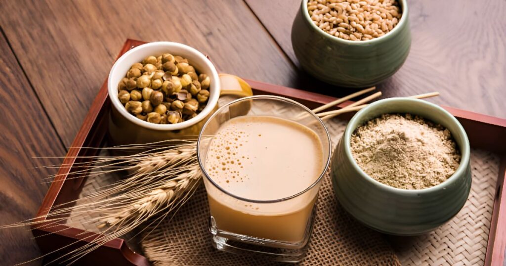 A tray displaying milk, cereal, and various ingredients needed to prepare Sattu drink.