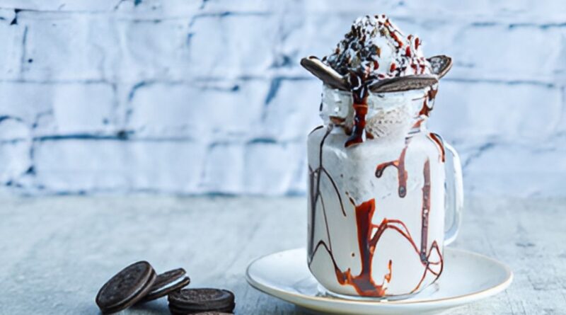 Oreo milkshake topped with chocolate drizzle and whipped cream, inspired by Chick-fil-A's creamy recipe.